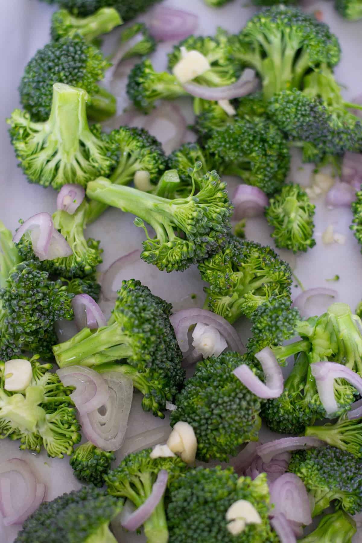 Before cooking - the broccoli, shallots and garlic on a cookie sheet