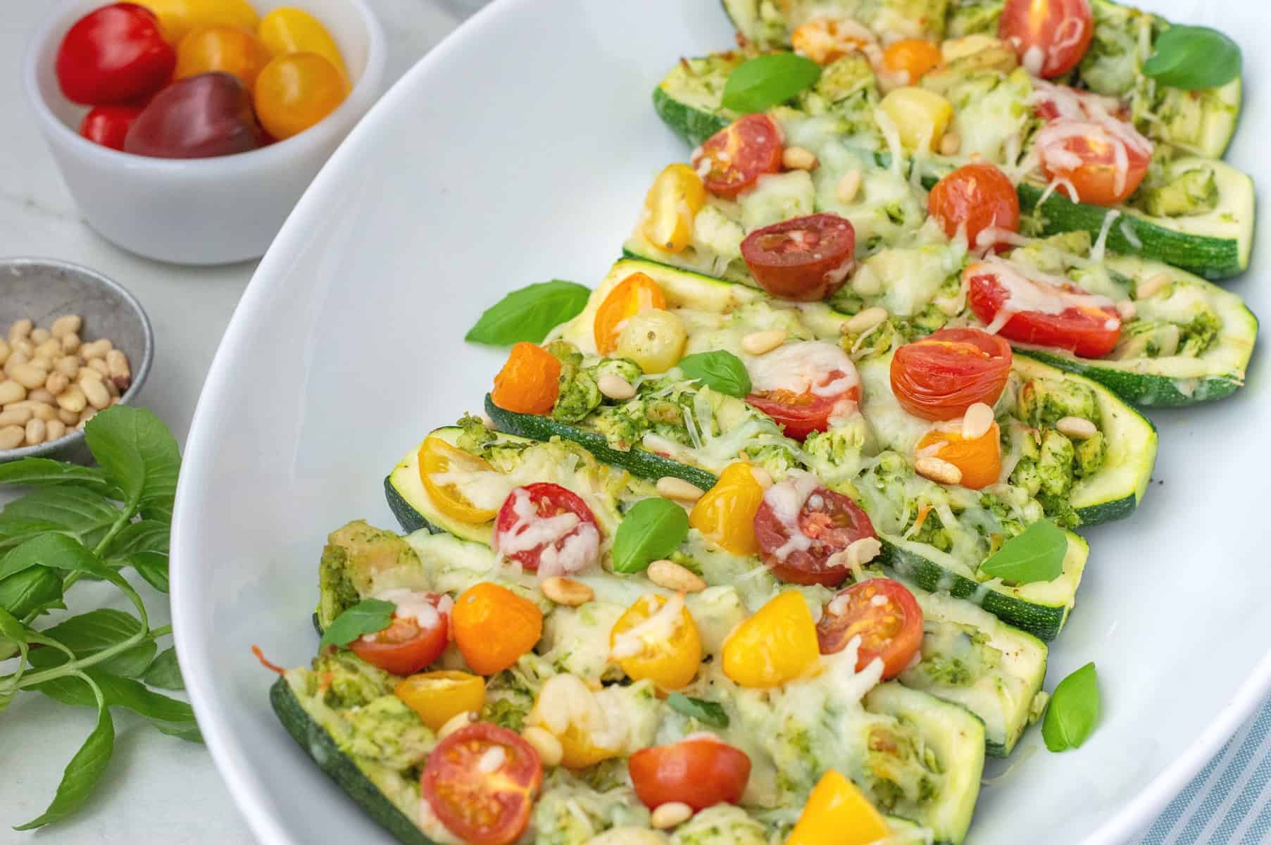 Pesto Chicken Zucchini Boats with Cherry Tomatoes