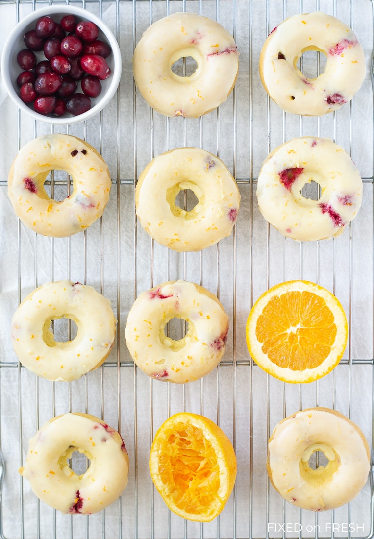 Cranberry Orange Baked Donuts are easy to make and healthier than the ones you get at the donut shop with half the calories and no trans fats! This fall breakfast recipe will be perfect to serve Thanksgiving morning! #autumn #fallrecipe #bakeddonuts #healthydonut #donuts