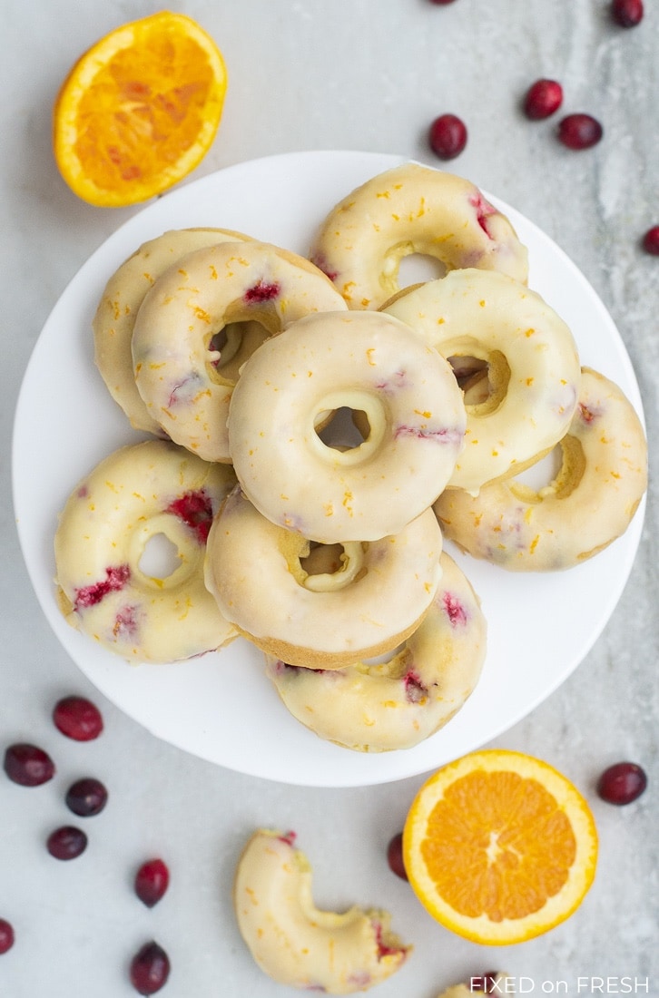 Cranberry Orange Baked Donuts are easy to make and healthier than the ones you get at the donut shop with half the calories and no trans fats! This fall breakfast recipe will be perfect to serve Thanksgiving morning! #autumn #fallrecipe #bakeddonuts #healthydonut #donuts