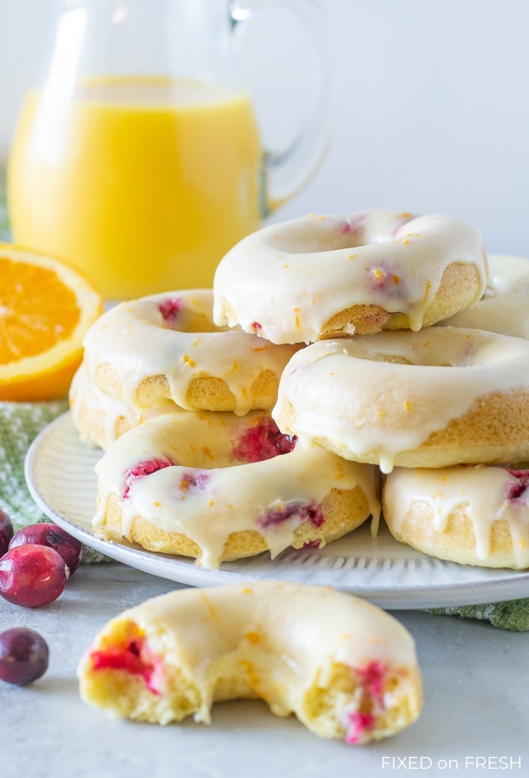 Cranberry Orange Baked Donuts are easy to make and healthier than the ones you get at the donut shop with half the calories and no trans fats! This fall breakfast recipe will be perfect to serve Thanksgiving morning! #autumn #fallrecipe #bakeddonuts #healthydonut #donuts