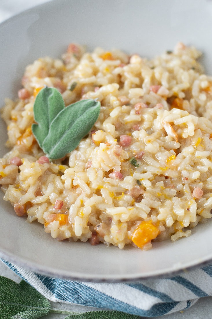 Autumn Risotto is filled with fall flavors like butternut squash and sage with a tasty twist of pancetta instead of parmesan, so it's completely dairy free! This is a huge hit with the kids, so it's a great fall family dinner. #risotto #butternutsquash #fallrecipe #pancetta #kidfriendly