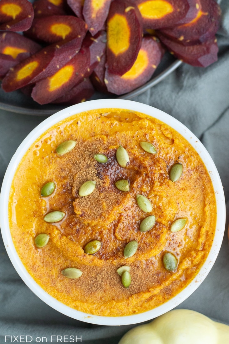 Pumpkin Spice Hummus is an easy autumn appetizer that's great for Halloween or Thanksgiving. This hummus is made without tahini and is vegan, gluten free, dairy free and low calorie.  #hummus #glutenfree #dairyfree #pumpkinspice #appetizer #healthydip #vegan