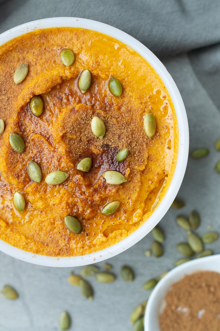Pumpkin Spice Hummus is an easy autumn appetizer that's great for Halloween or Thanksgiving. This hummus is made without tahini and is vegan, gluten free, dairy free and low calorie.  #hummus #glutenfree #dairyfree #pumpkinspice #appetizer #healthydip #vegan