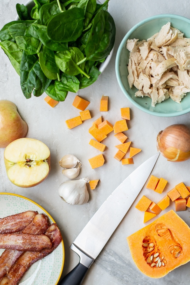 A healthy, egg free skillet breakfast that is paleo, Whole30 and high protein. This Harvest Skillet recipe is filled with bacon, butternut squash, apples, spinach and tons of leftover turkey! Great for Thanksgiving leftovers!