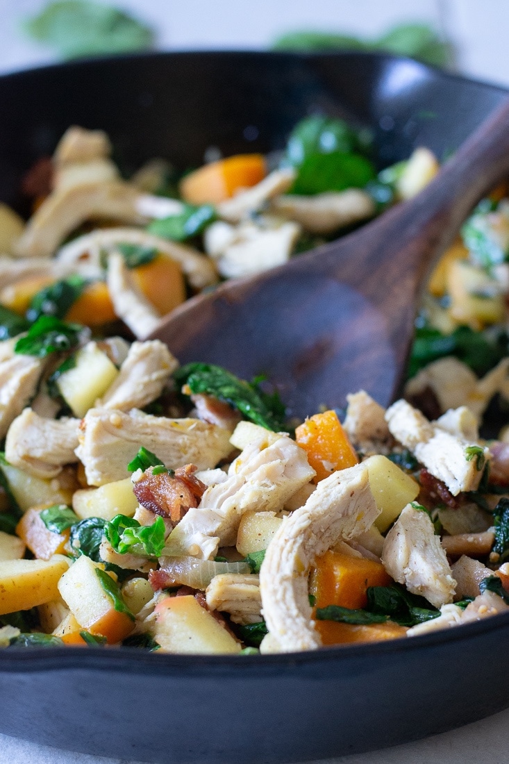 A healthy, egg free skillet breakfast that is paleo, Whole30 and high protein. This Harvest Skillet recipe is filled with bacon, butternut squash, apples, spinach and tons of leftover turkey! Great for Thanksgiving leftovers!