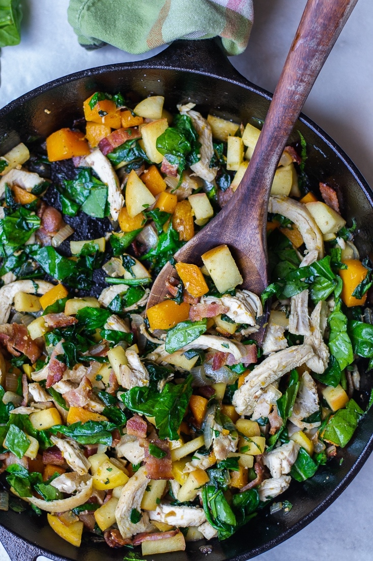 A healthy, egg free skillet breakfast that is paleo, Whole30 and high protein. This Harvest Skillet recipe is filled with bacon, butternut squash, apples, spinach and tons of leftover turkey! Great for Thanksgiving leftovers!