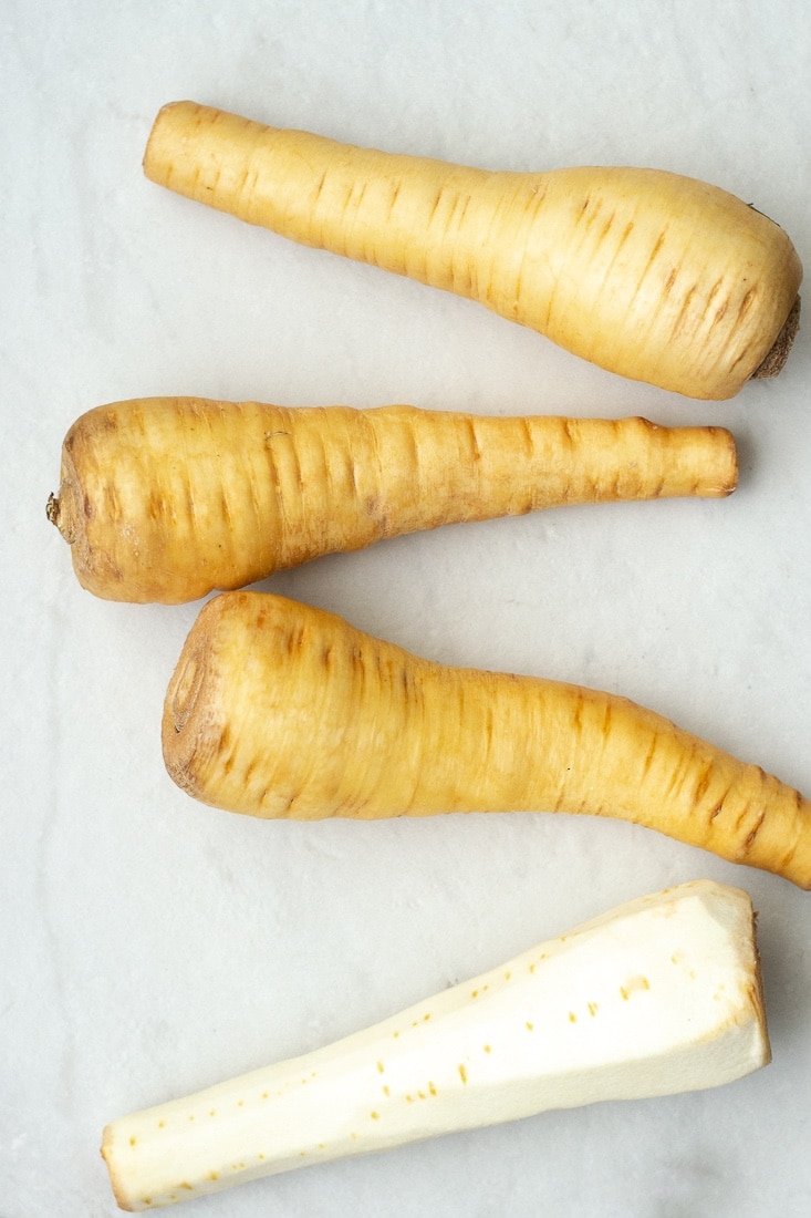 Garlic and sage whipped parsnips are a creamy and healthy side for all your favorite chicken and steak recipes. This dairy free parsnip puree recipe is paleo and whole30 approved!