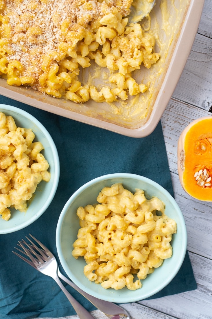 Creamy Butternut Squash Baked Mac and Cheese is a low calorie version of traditional mac and cheese. This makes a great additional to your Thanksgiving or Christmas meal and can easily be made gluten free! #glutenfree #butternutsquash #comfortfood #macandcheese #fallrecipe #autumnrecipe #lowcalorie