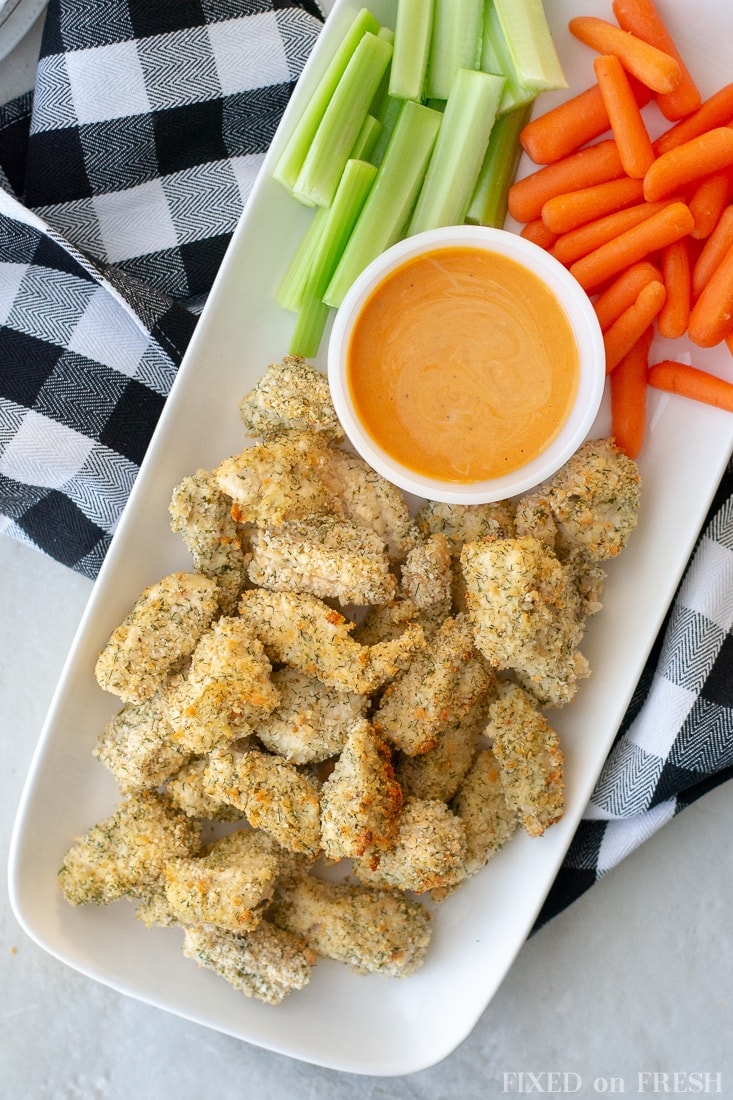 Gluten free baked and crispy ranch chicken nugget are a great kid friendly dinner and can be served with Whole30 buffalo ranch dipping sauce to make it an awesome appetizer for Super Bowl parties. #superbowl #glutenfree #dairyfree #familydinner #kidfood