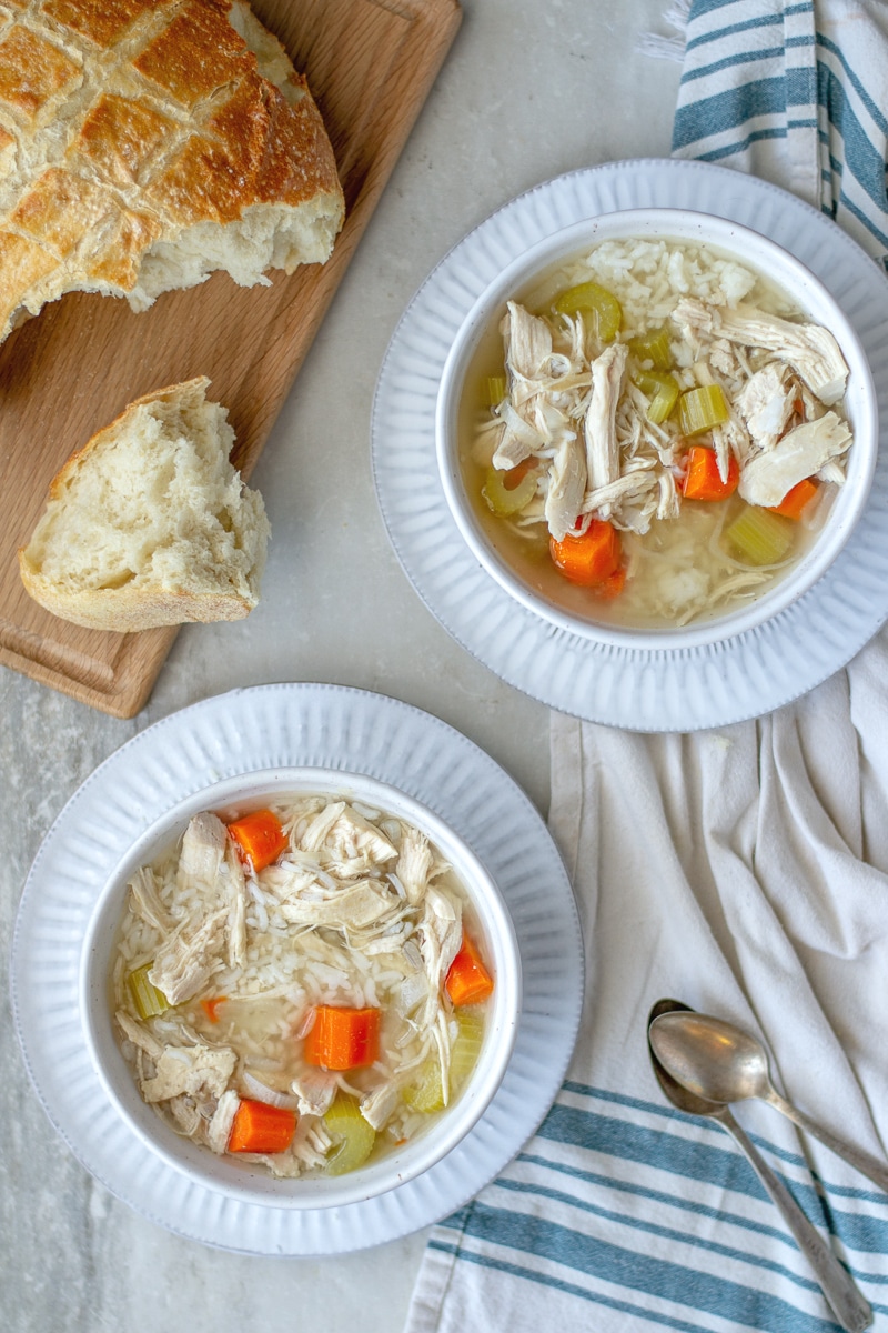 Crockpot chicken and rice soup is an easy set and forget homemade dinner that is heathy and delicious. Learn how to make it on the stovetop as well! #chickendinner #healthyreceipe