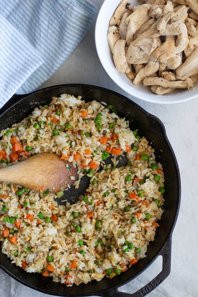 Homemade, better than takeout Chicken Fried Rice is healthier, soy free and awesome for meal prep. These best part is this simple and delicious recipe only takes 20 minutes to make!