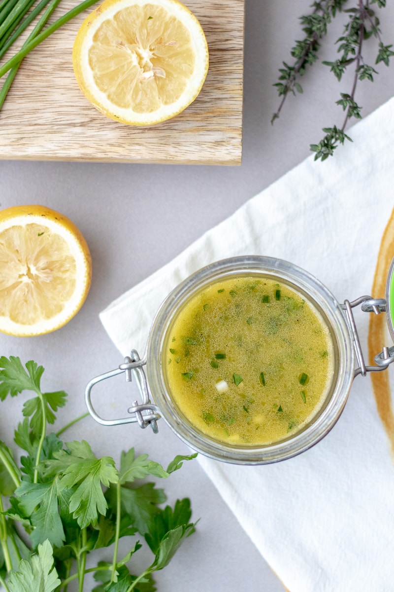 Lemon Herb Vinaigrette is an easy Whole30 and Paleo salad dressing recipe that can be used as a chicken or pork marinade too! Using all fresh ingredients, this can be whipped up in 5 minutes. #whole30 #salad #paleo