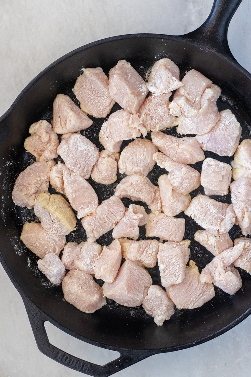 Floured chicken pieces before browning