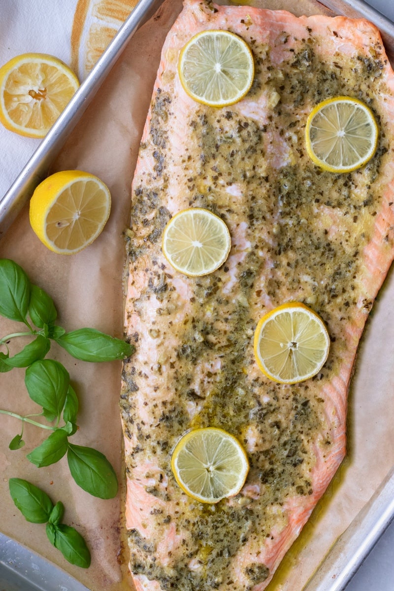 Pesto butter salmon is perfect for weeknight dinners, meal prep and is low carb or keto too. This whole salmon fillet is on the table in just 15 minutes!