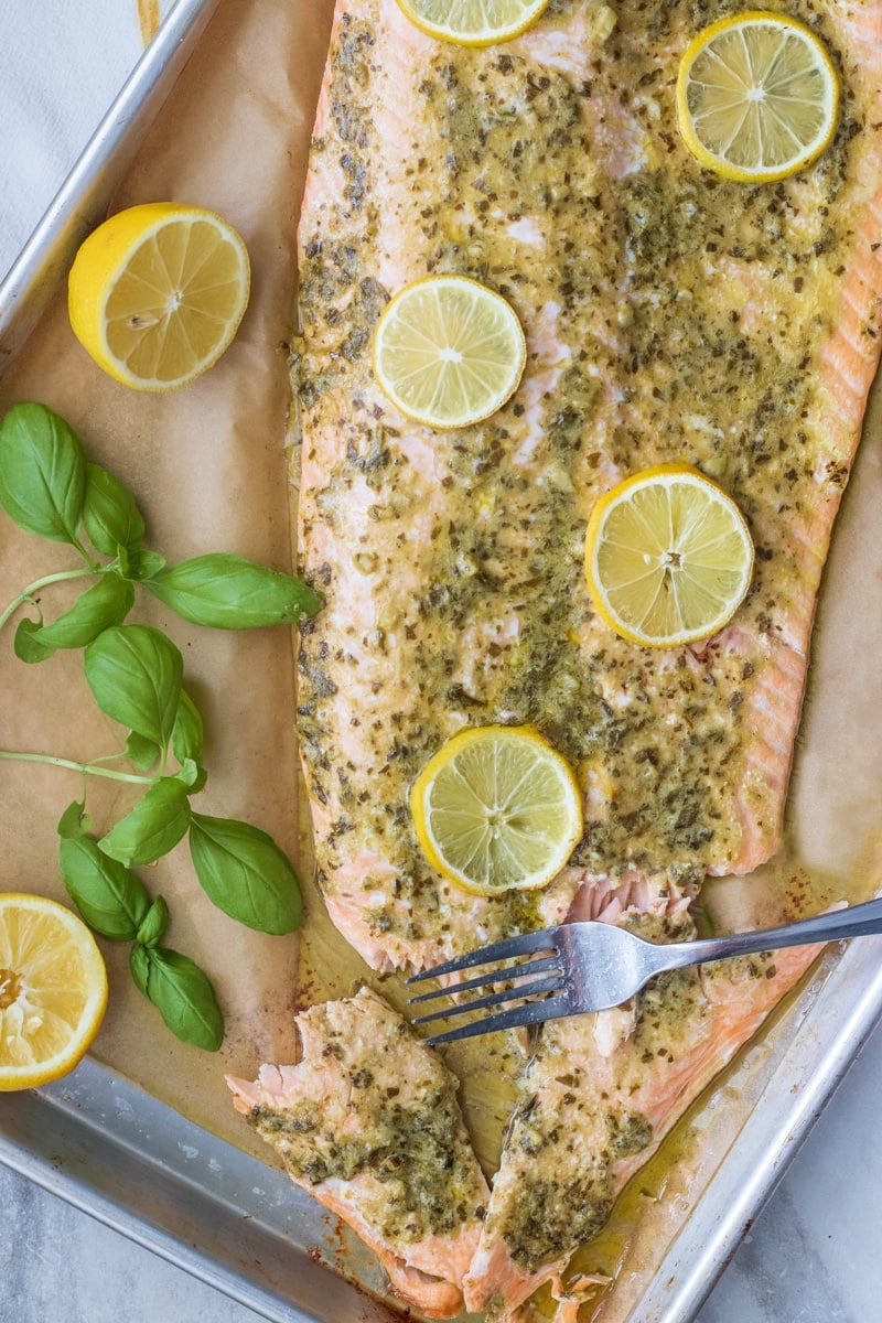 Pesto butter salmon is perfect for weeknight dinners, meal prep and is low carb or keto too. This whole salmon fillet is on the table in just 15 minutes!