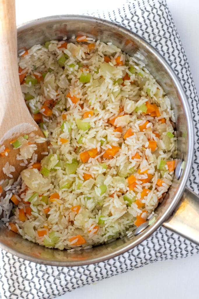 Add the rice and coat in butter, saute the rice until it starts to become translucent. 