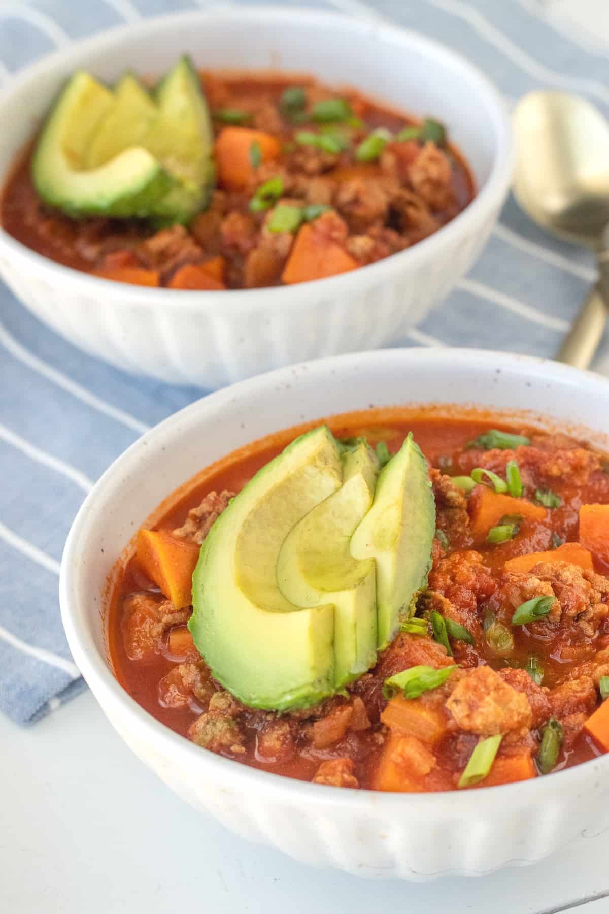 Healthy turkey chili is made with sweet potato and no beans so that it's Paleo and Whole30 friendly. Lean ground turkey is simmered with onions, bell peppers, tomatoes, and some pantry staples to make a quick and easy weeknight dinner (or meal prep!)