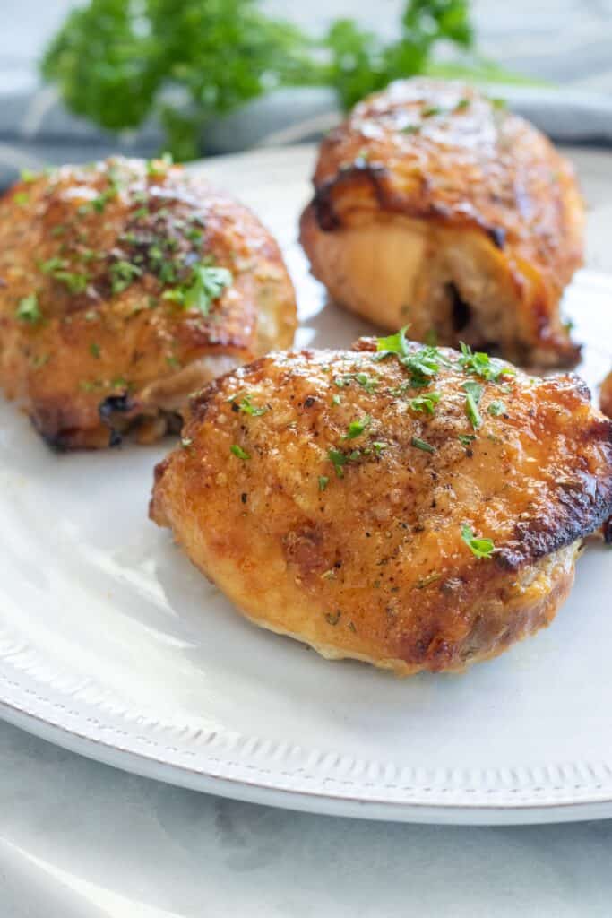 Finished crispy baked chicken thighs with honey mustard